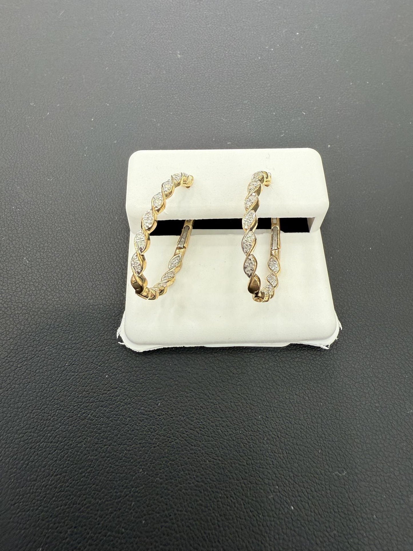 0.25 cttw Diamond Twist Inside Out Oval Hoop Earrings 10k Yellow Gold